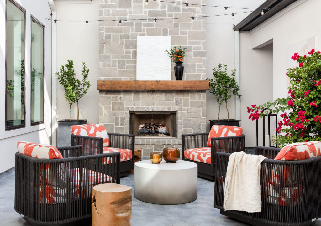 The courtyard is perfect for relaxing when the weather is good.  Lohman loves the pop of orange.