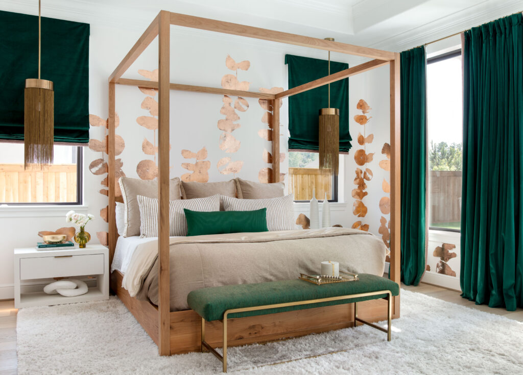 The primary bedroom is everyone's favorite, according to owner Heather Lohman, including the dog. The bold green velvet curtains one of the reasons why. (Photo by Kerry Kirk)