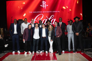 The 1993-94 NBA champs Houston Rockets team with the Fertittas: Tilman, Patrick, Blake, Paige, and Michael at the Clutch City Foundation gala at the Post Oak Hotel.