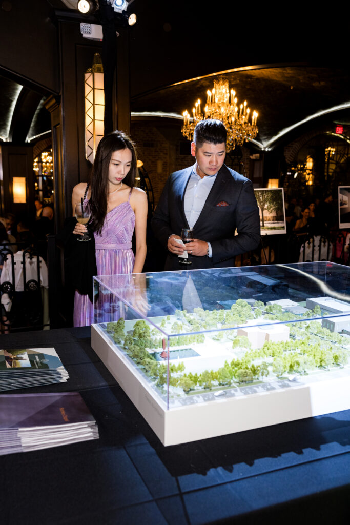 Livy and Victor Lee looking at Rothko Chapel's Opening Spaces campaign model