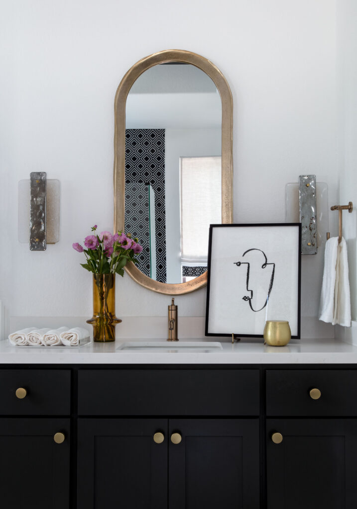 The vanity in the primary bath has mixed metals, creating a contemporary feel.