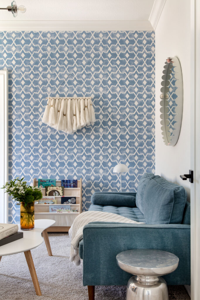 Wallpaper provides a modern touch in the girls' lounge area.