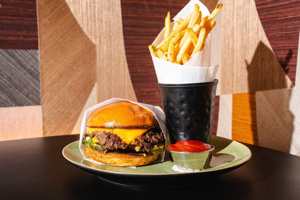 Every hotel should have a great burger on their menu. At Sol 7, it's a smash burger made with a wagyu cut of beef.  (Photo by Michael Anthony)