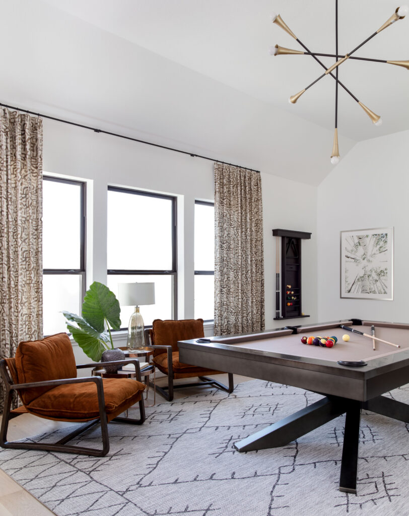 The game room has a pool table plenty of room for games of all types.