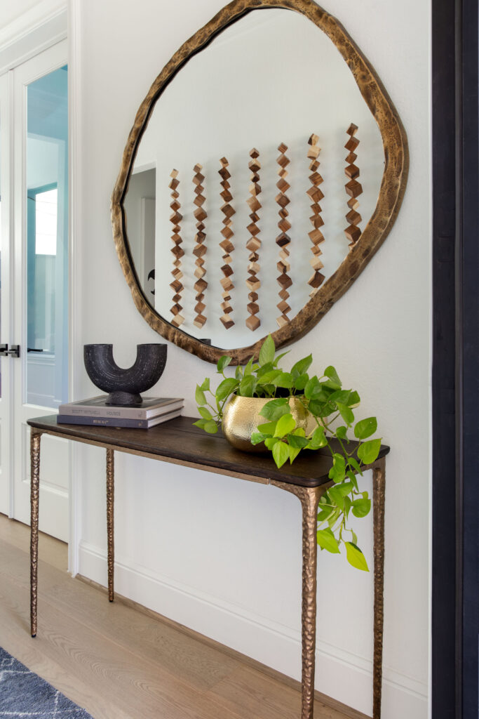 The entry foyer has a large mirror providing reflection.