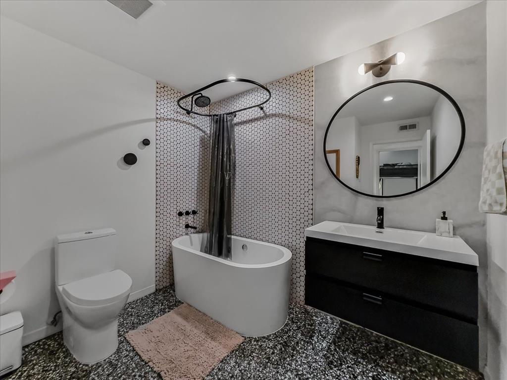 A handsome soaking tub in the second bathroom.
