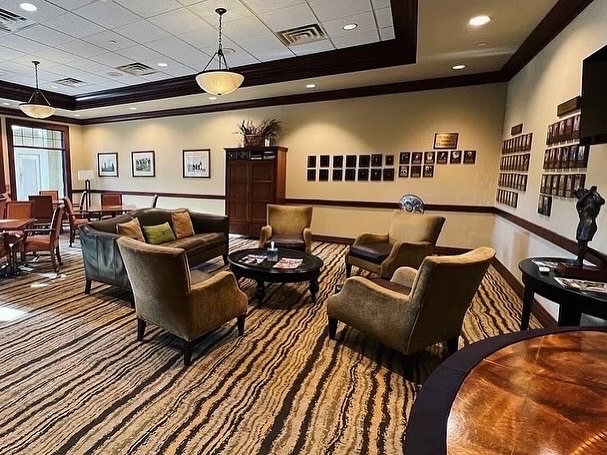 (Before) The Ladies' Lounge at the Palmer Course was dark and dreary before Woodlands Style House created a bright, welcoming redo.