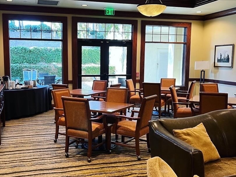 (Before) The Ladies' Lounge at the Palmer Course had seating for games or cards, but needed an update. 