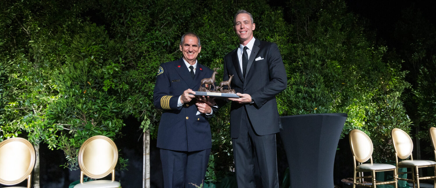 Fire chief Palmer Buck accepted the Mitchell Award on behalf of the Woodlands firefighters from Howard Hughes president of Houston region Jim Carmen.