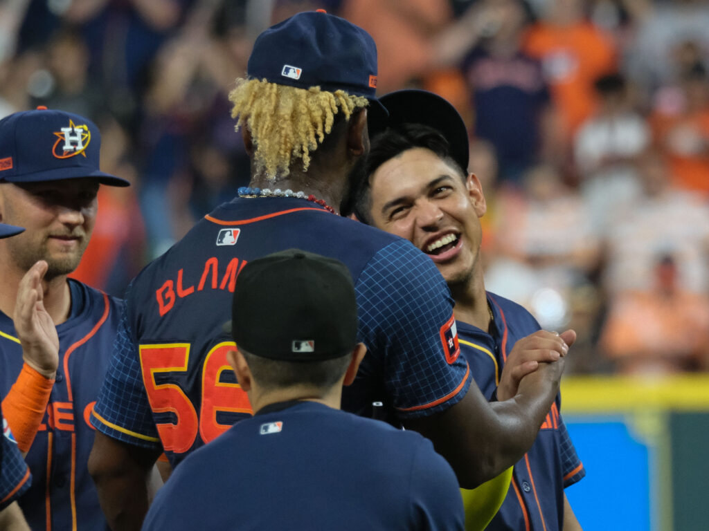 Houston Astros pitcher Ronel Blanco shared a moment with defensive replacement Mauricio Dubon after his no hitter. (Photo by F. Carter Smith)