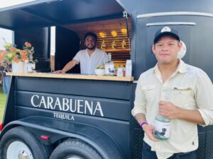Booze News – April – Founder Victor Diaz holds a bottle of his Carabuena silver tequila. (Photo by Courtney Dabney)