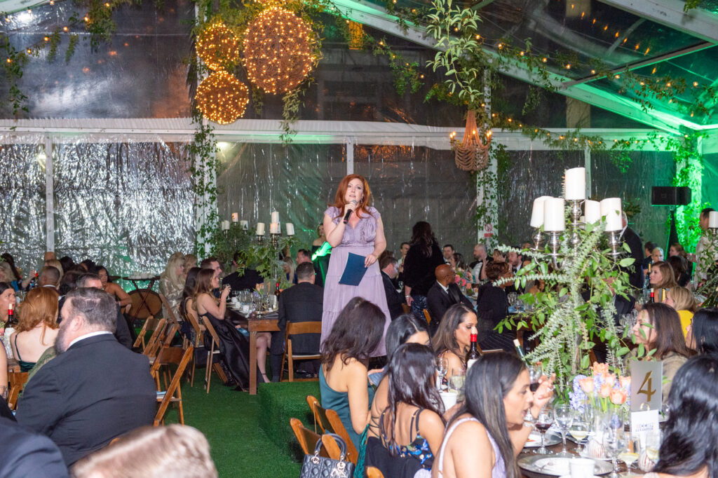 Brandi Smith serves as emcee for the Junior League of Houston Charity Ball "paddles up" and Big Board auction. (Photo by Jacob Power)
