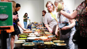 People peruse bowls at Empty Bowls Houston. (Courtesy Empty Bowls Houston)