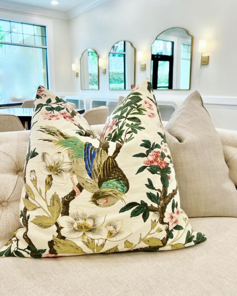 The one pop of color in the room is in the cheerful sofa pillows.