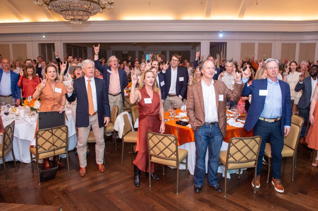 Guests singing the 'Eyes of Texas' at the Texas Exes Longhorn Legacy Scholarship Gala (Photo by Jacob Power)