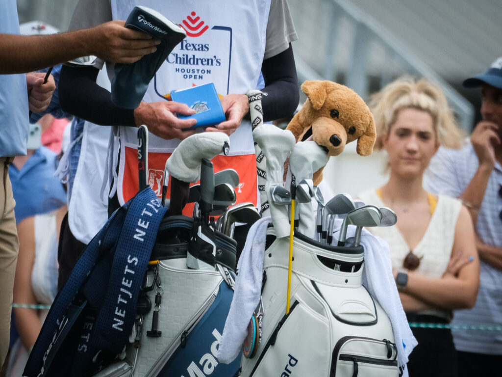 A caddie's life is never easy on the PGA Tour. (Photo by F. Carter Smith)