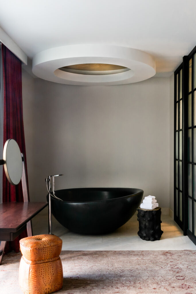 Some of the suites include cool, black bathtubs. (Photo by Lisa Diederich Photography)