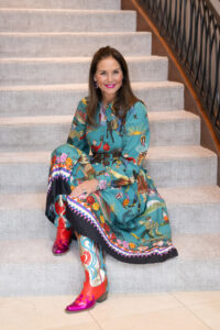 Rieke Common wears a dress from her Wild Wild West collection during a personal appearance at Elizabeth Anthony. (Photo by Wilson Parish)