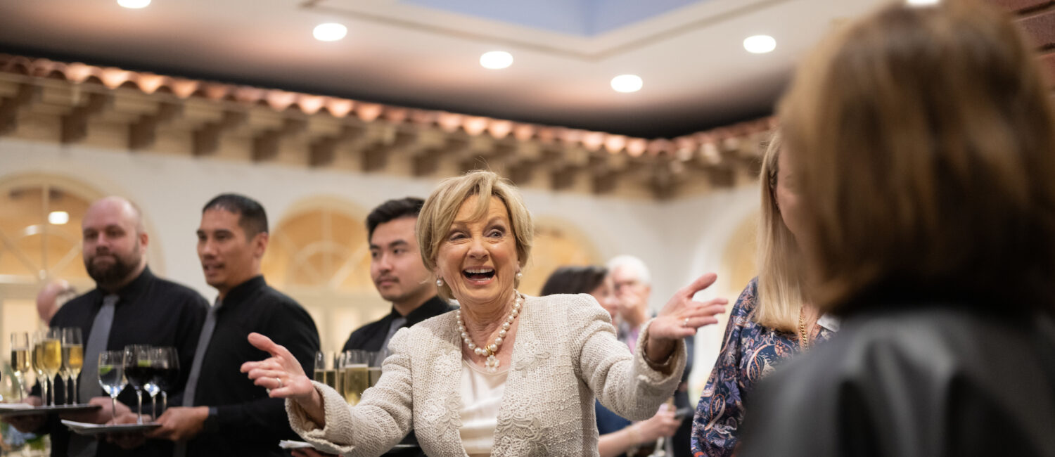 Suzie Johnson greets attendees (Daniel Ortiz)