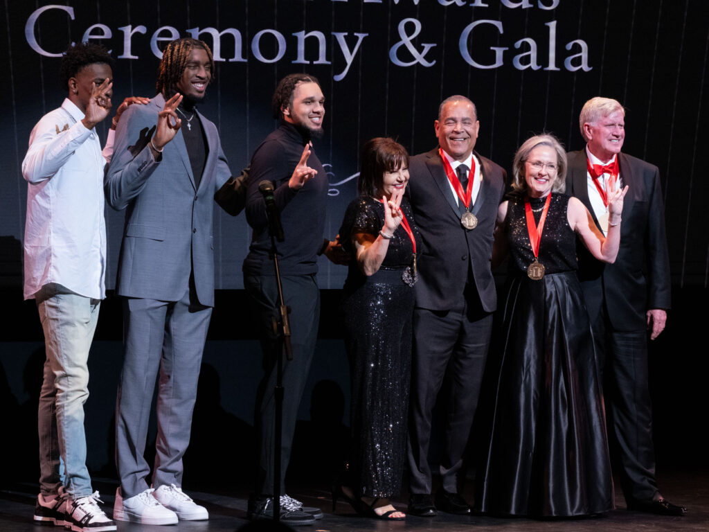 University of Houston basketball players Terrance Arceneaux, Ja'Vier Francis and Emnauel Sharp took to the stage at the Hobby Center to celebrate Karen and Kelvin Sampson's award moment.  (Photo by F. Carter Smith)