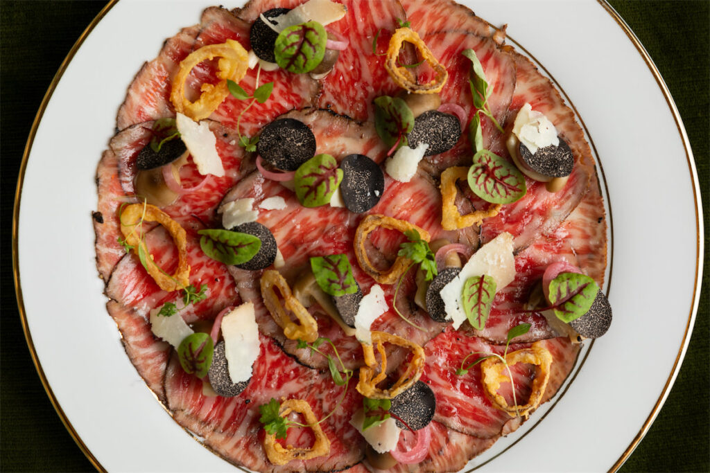 At each Delilah, the menu pays homage to the destination with location-specific dishes.