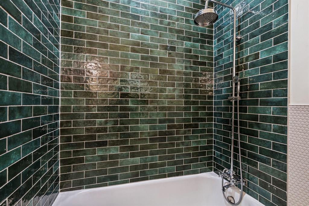 A slick tile-lined shower. 