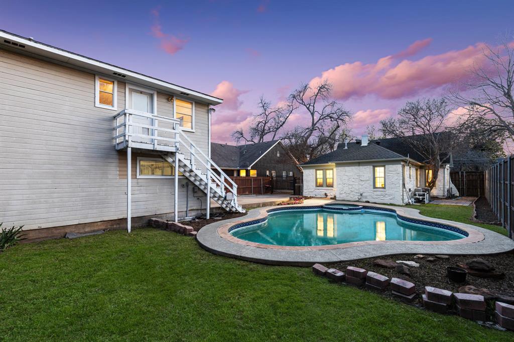 Out back, a manicured backyard pool is perfect for hosting and a quaint mother-in-law suite can be used for a studio or a bit of extra income. 