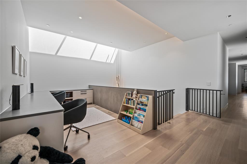 An upstairs landing doubles as an office or playroom.