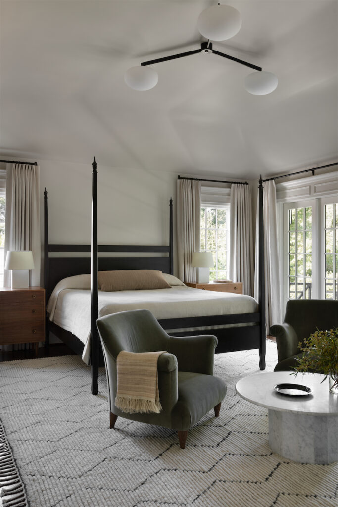 In the main bedroom, Armadillo Moroccan rug. Vintage 1950s Greta Grossman for Glenn of California dressers from 1stdibs. Pair of lounge chairs from The Future Perfect. Kevin Frankental-designed 2010 marble coffee table from South Africa. Bed made by Noir. Gallery L7 chandelier. (Photo by Trevor Parker)