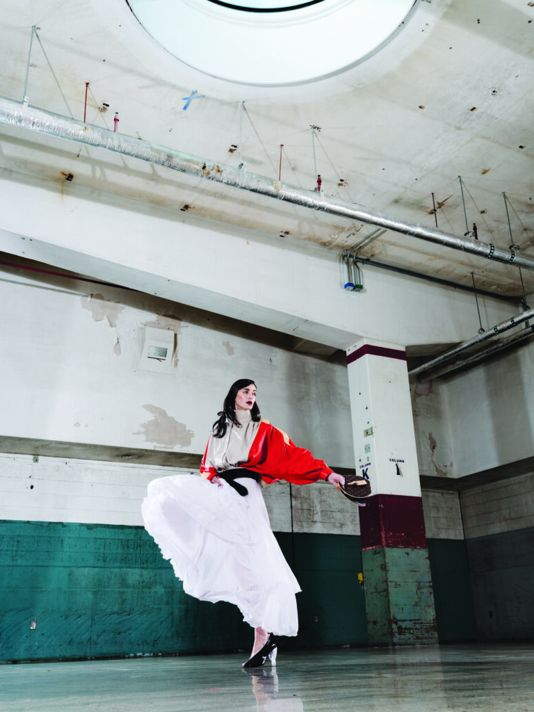 Louis Vuitton color-blocked gathered leather jacket $6,560, fluid silk tiered skirt $5,800. LV wrapped 60mm belt $1,360 and LV knot pump $1,360. 