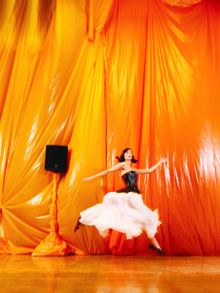 Louis Vuitton corset-top tiered dress $13,700, and Zippy-flat loafer $1,100. 