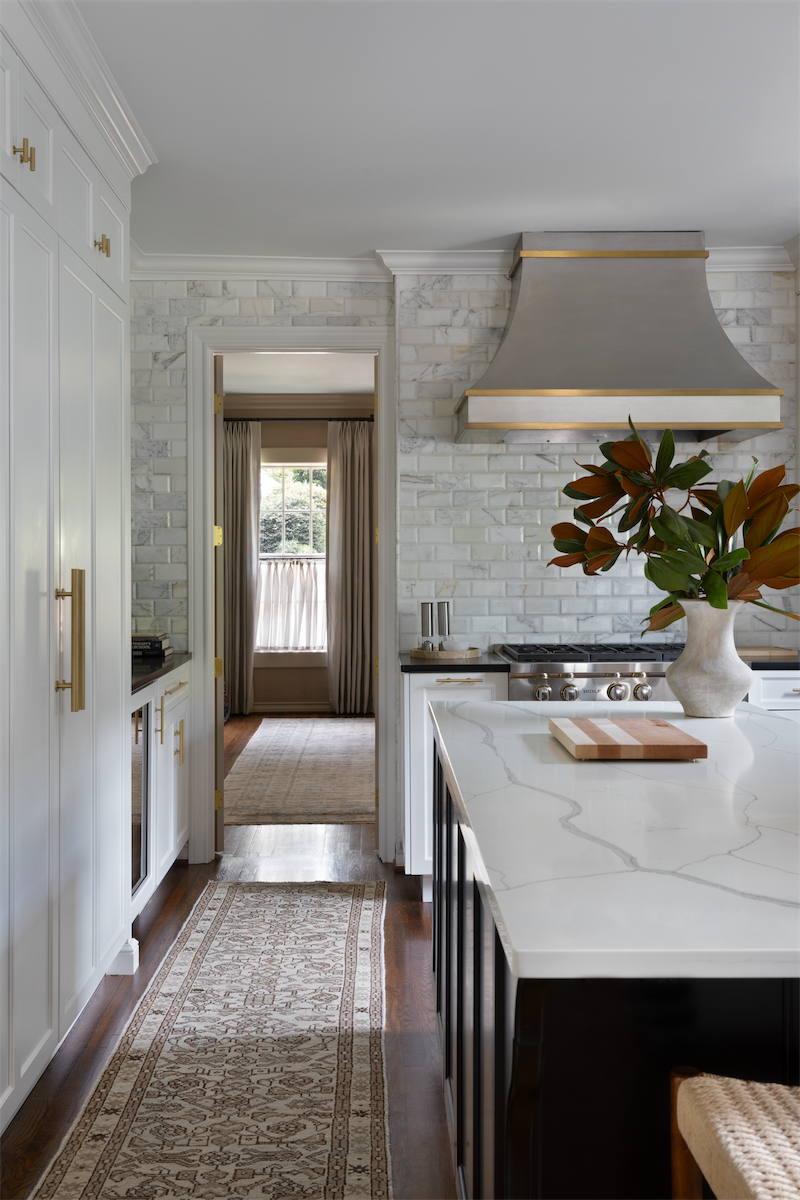 Fort worth home tour - a slick white-tiled kitchen