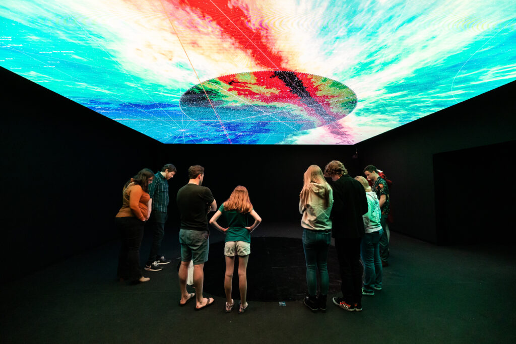 One of many sections of Space Explorers: The Infinite includes multimedia art work. (Photo by Melissa Taylor)