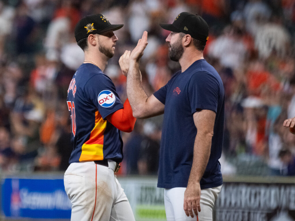 Kyle Tucker and Justin Verlander share a low key celebration moment with the Astros. (Photo by F. Carter Smith)
