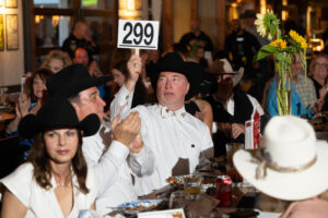 Greg Ploss wins an auction item at the 13th annual K9s4COPS 'Unleashed Gala' (Photo by Daniel Ortiz)
