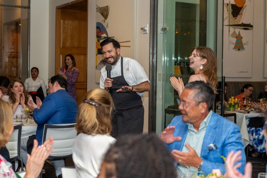 Chef Aaron Bludorn and Zoe Lucich sharing the inspiration behind their dish at the Houston Ballet 'Raising the Barre' dinner at Caracol. (Photo by Melissa Taylor)