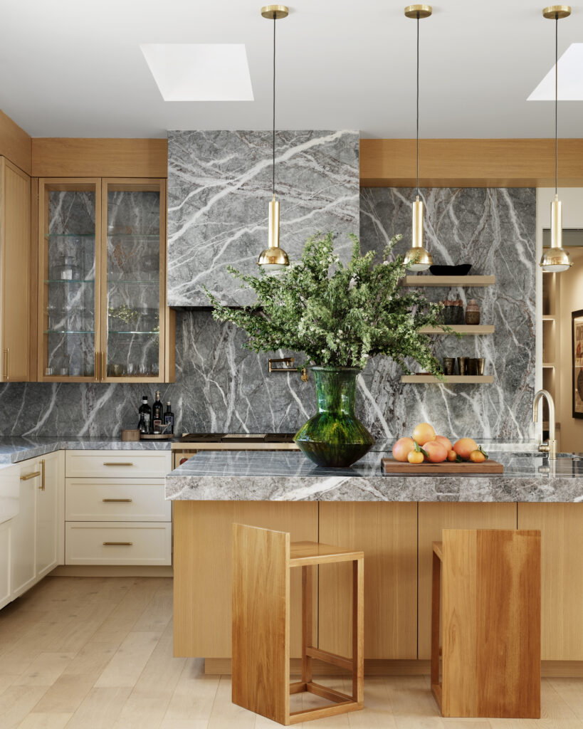 Jackson Paige Interiors: open space, grey marble, chef's kitchen. (Photography by Christopher Sturman)