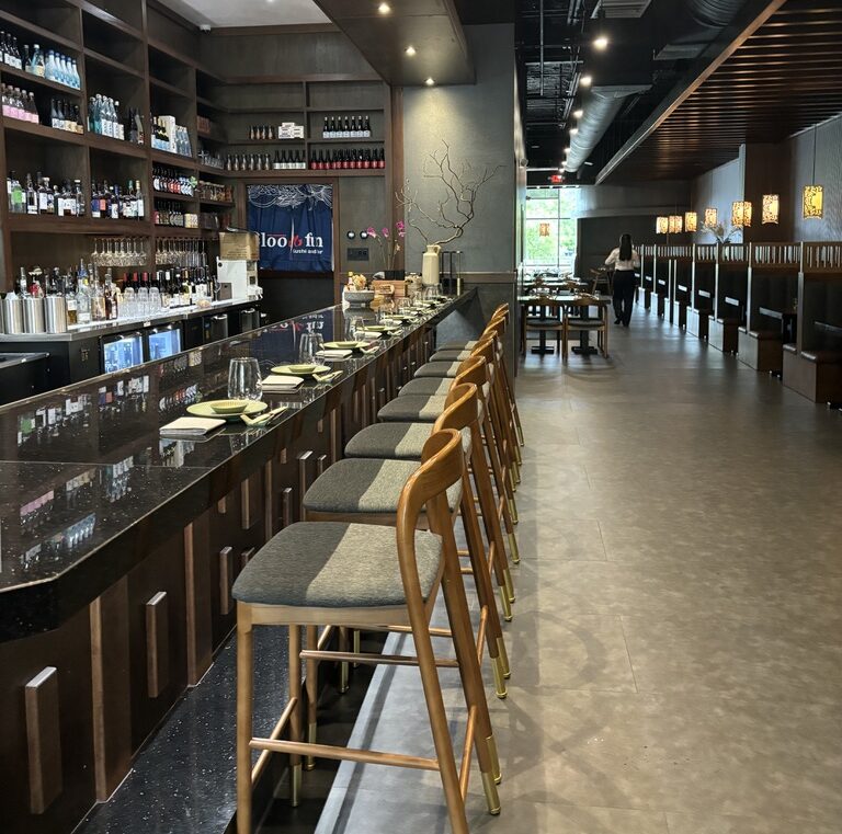 The bar at Bloofin Sushi has seating for eight, with booth and table seating available indoors. Some patio dining overlooking Lake Woodlands, is available too. (Photo by Laura Landsbaum)