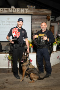 Fire Marshal Ryan Smith, Sgt. Chris Moore and K9 Ember (Photo by Daniel Ortiz)
