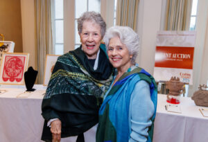 Kitty Rabinow and Betty Moody sport cashmere scarves by Rabinow at the Houston Center for Contemporary Craft spring luncheon 2024 (Photo by Katy Anderson)