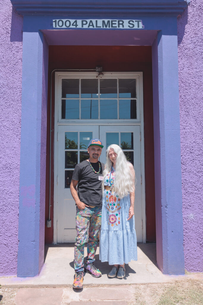 Gonzo247 with previous property owner Mickey Phoenix in front of the Luckie Schoolhouse (Photo by Luz Rodriguez)