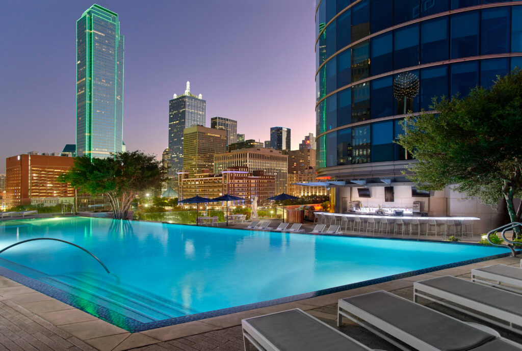 Explore Dallas during the day and then relax at Omni Dallas' rooftop pool.