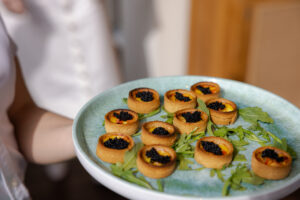 Roasted Tomato Quiche- Red pepper, caramelized onion, caviar (Photo by Robert Underwood)