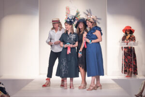 Sabina Carr, CEO of the Dallas Arboretum and Botanical Garden, presented the category Olympic Games to Sarah Fletcher, Karen Schaffer, Kristen Scott.  (Photo by Thomas Garza and Rob Wythe)
