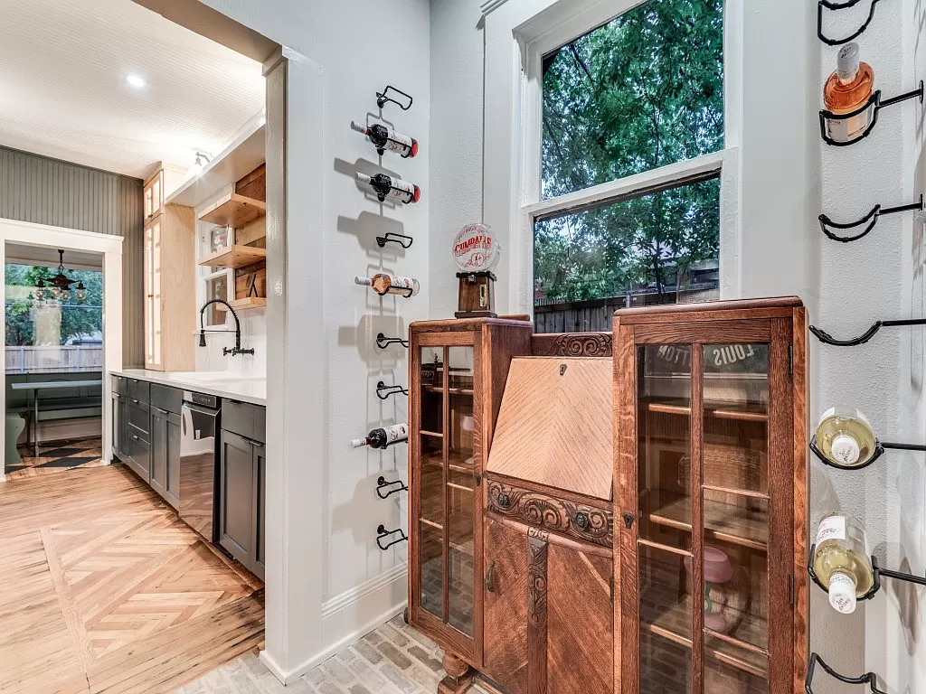 A cozy nook serves as wine storage. 