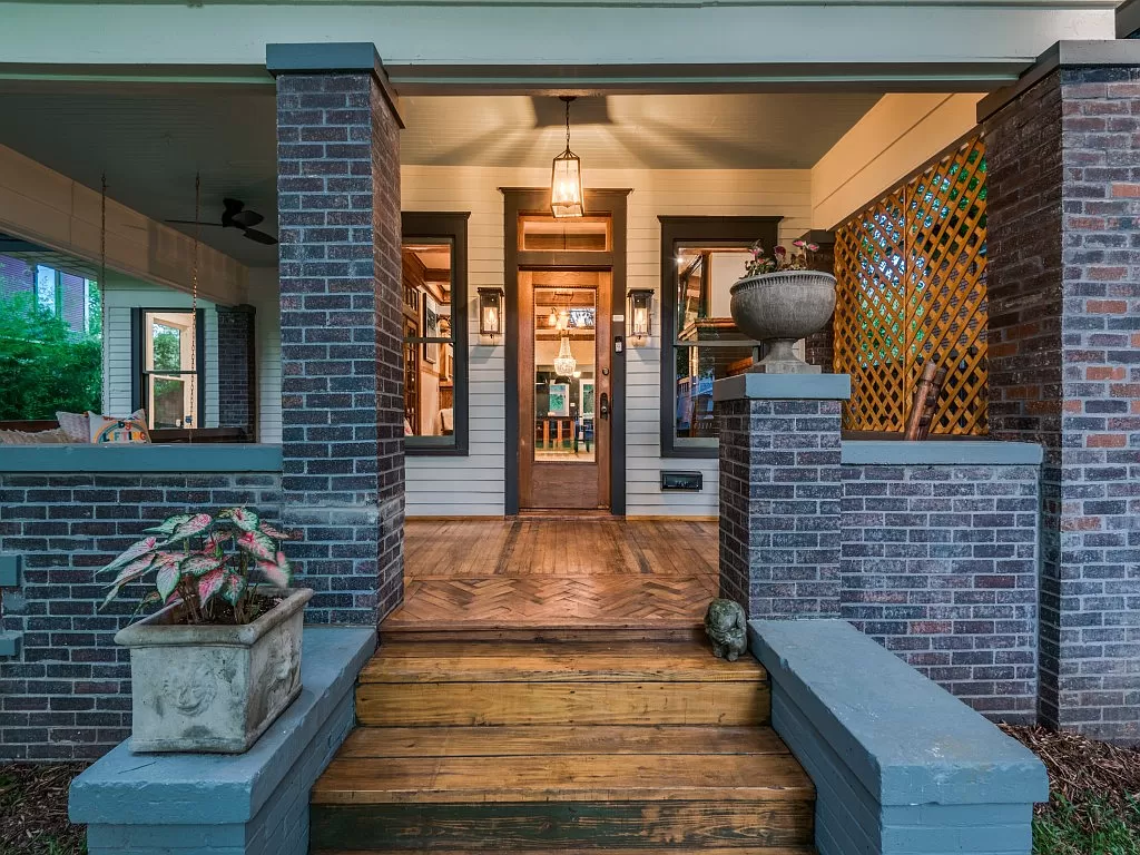 Gas lanterns welcome at the revived Dallas Craftsman home in the Peak’s Suburban Addition Historic District.