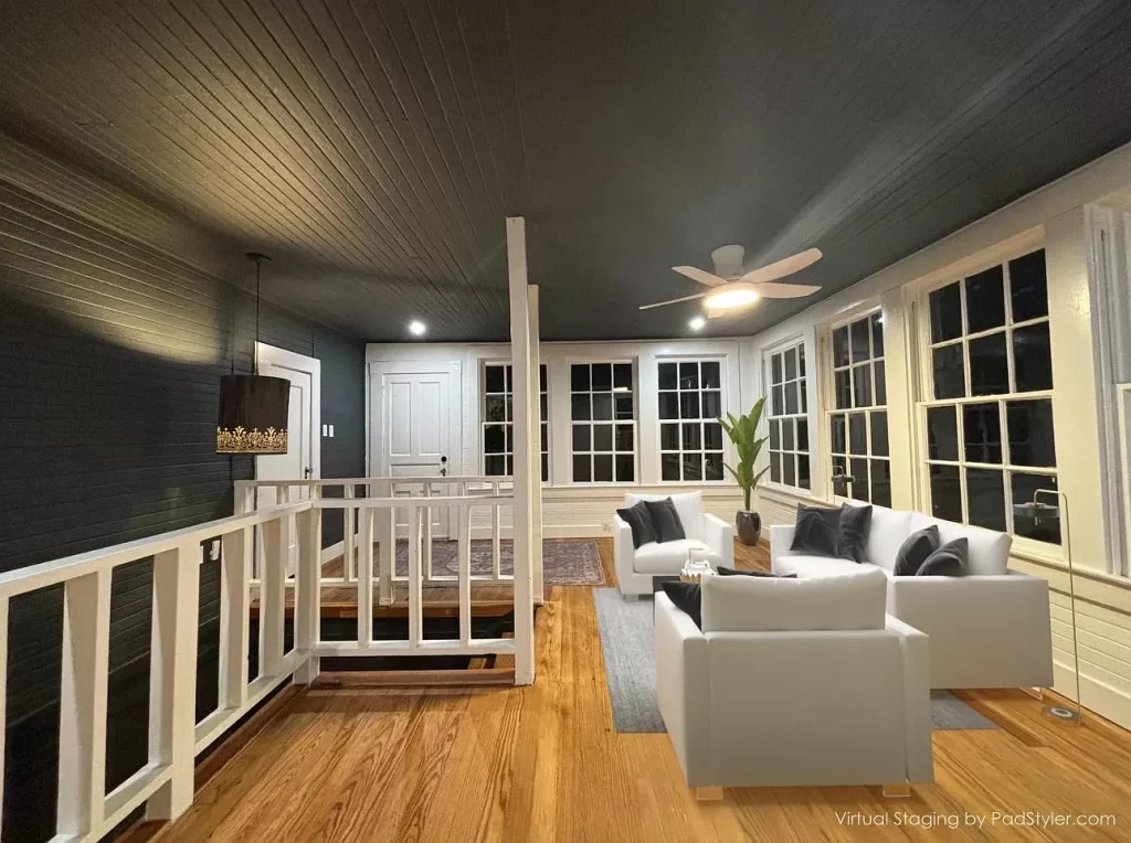 A window-lined upstairs lounge area. 