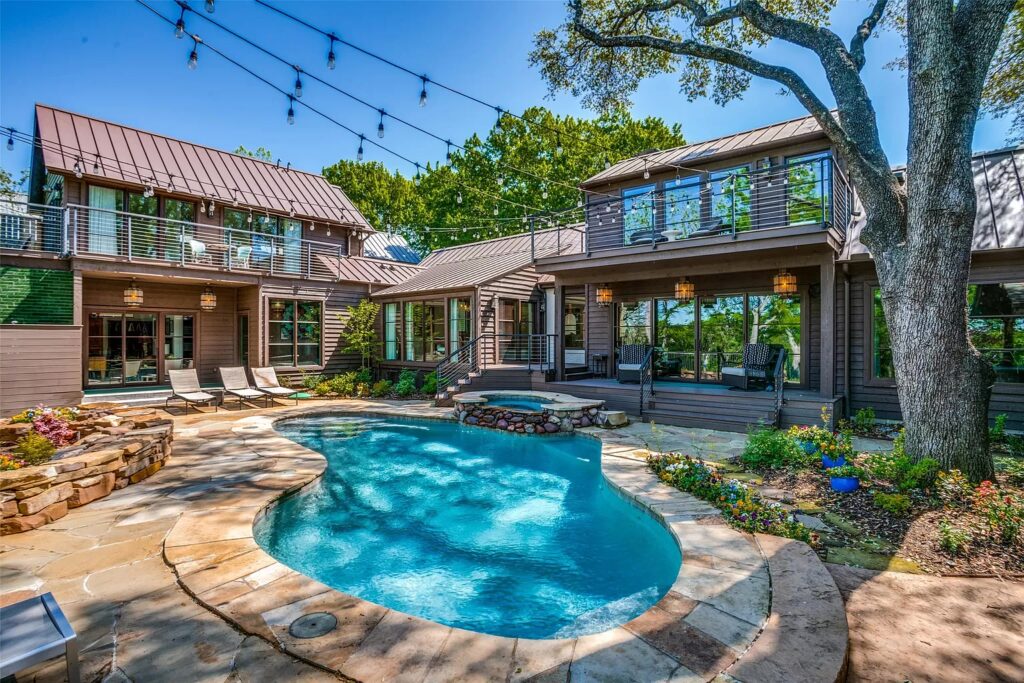 The home is positioned around its stellar backyard.