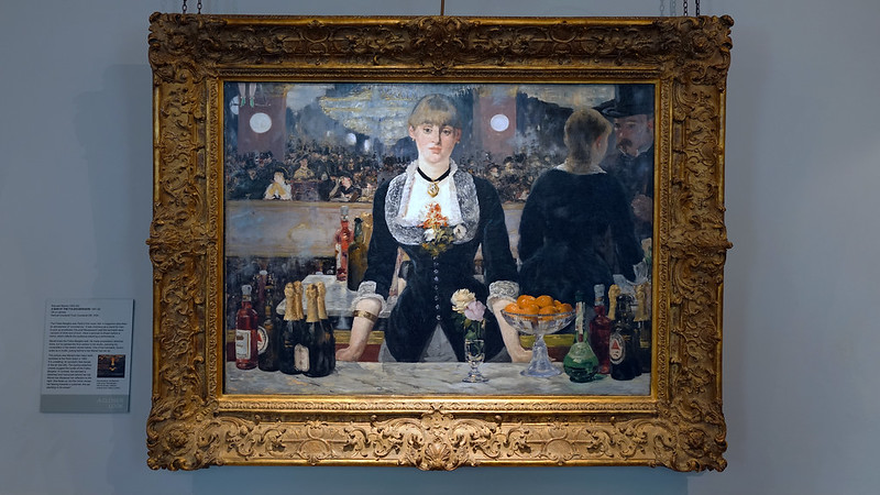 Édouard Manet’s "A Bar at the Folies-Bergère," 1882. Houston-based artist Alexis Pye was inspired by Manet's artwork while painting "Night Out," 2024. 
 (Courtesy My Modern Met)