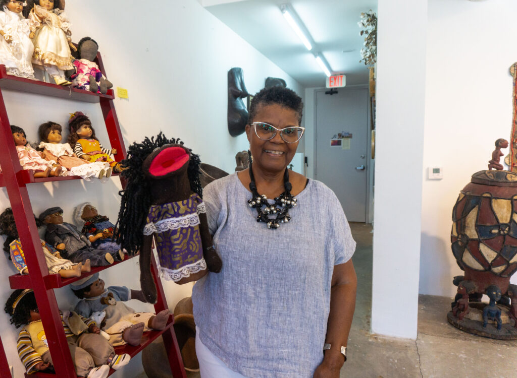 Merian Sherrod and her donated puppet at The Community Artists' Collective Ashé Summer Market (Photo by Sofia Westerman) 
